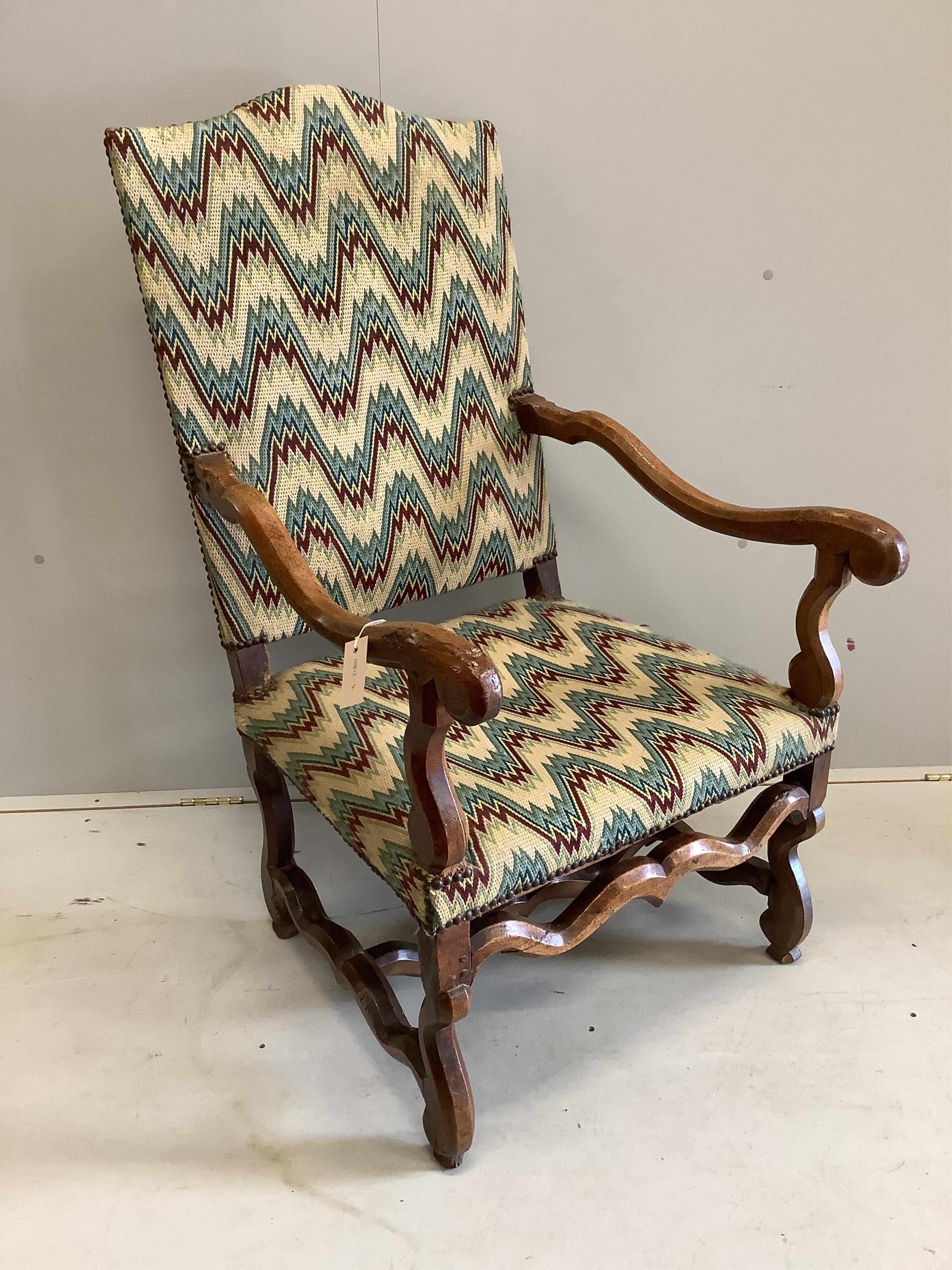 A 19th century French walnut armchair, in the 17th century style, width 64cm, height 116cm. Condition - heavily wormed, frame wobbling